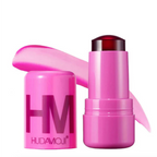 HUDA MOJI colorful lipstick collection featuring pink, coral, and red lipstick tubes with matching product packaging arranged on a soft pastel background.
