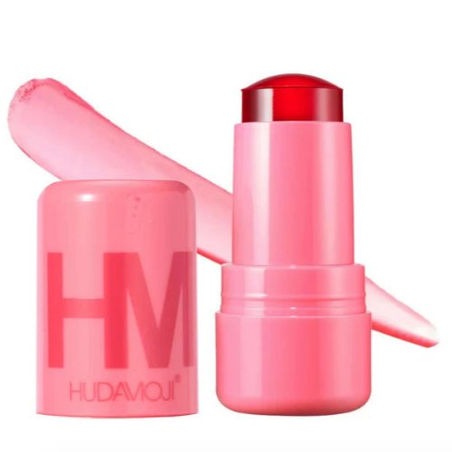 HUDA MOJI colorful lipstick collection featuring pink, coral, and red lipstick tubes with matching product packaging arranged on a soft pastel background.