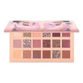 Huda Beauty The New Nude Eyeshadow Palette with nude, pink, mauve, and glitter shades