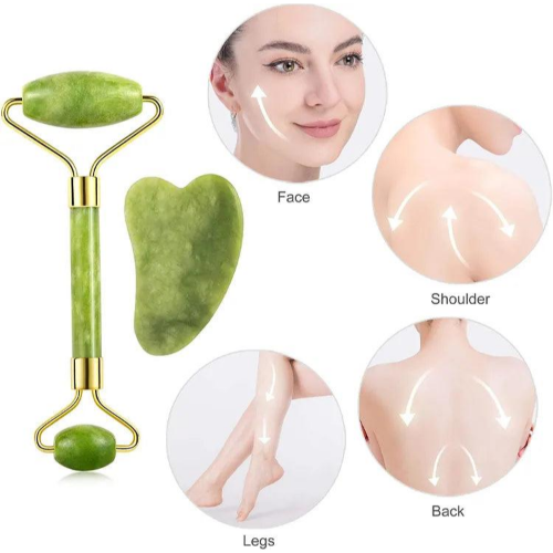 Green jade facial roller and heart-shaped gua sha stone for facial massage and skincare on a clean white background.