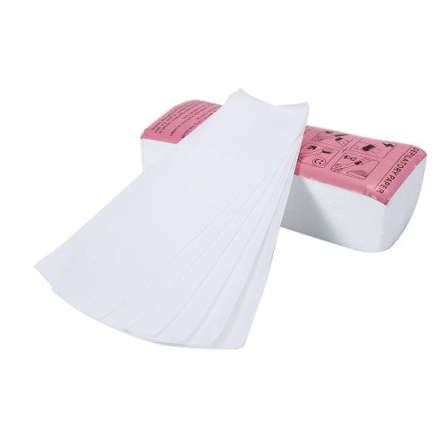 Pink roll-on wax heater with green wax cartridge and waxing strip for easy, smooth body hair removal at home.