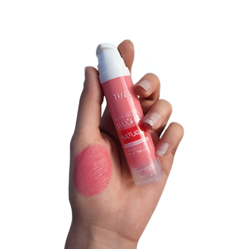 Pink liquid blush and lip tint with applicator, shown with a rosy pink swatch on the hand.