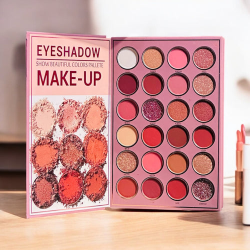 Mocallure Flower Palette in a pink floral book-style case displayed on a wooden surface. A 5-page all-in-one makeup palette featuring eyeshadows, blush, highlighter, concealer, and lipstick for complete makeup looks.