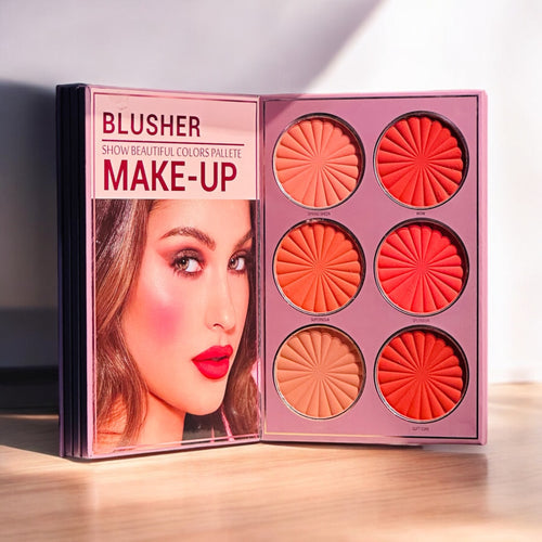 Mocallure Flower Palette in a pink floral book-style case displayed on a wooden surface. A 5-page all-in-one makeup palette featuring eyeshadows, blush, highlighter, concealer, and lipstick for complete makeup looks.