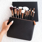 Zoeva 15-piece professional rose gold makeup brush set with soft face and eye brushes in a black travel pouch for flawless makeup 