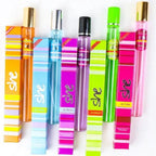 Colorful She pocket perfume collection featuring mini long-lasting fragrance bottles and matching perfume boxes in assorted scents.