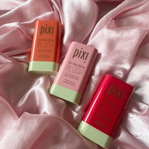 Pixi On-the-Glow Blush tinted moisture blush sticks in pink, coral, and rosy shades on a white background.